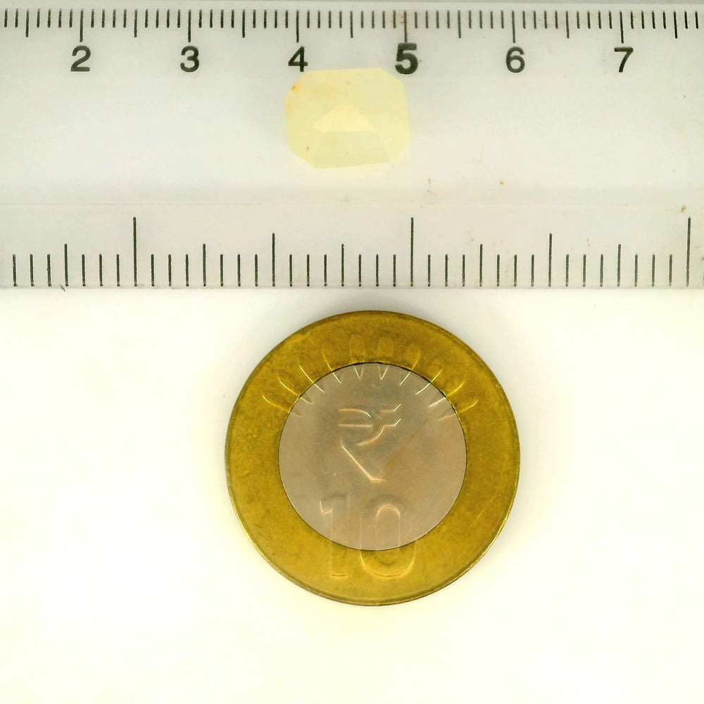 Yellow Sapphire (Pukhraj) 4.42 Carat / 4.92 Ratti, Unheated and Untreated – No indications of treatment observed – shown against scale for size