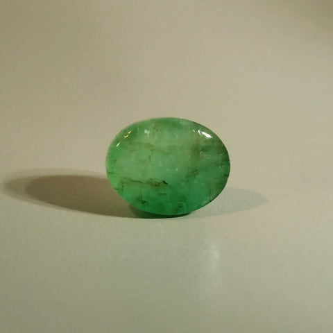 Colombian panna cabochon from Precious Carats stock, jardin visible, unretouched